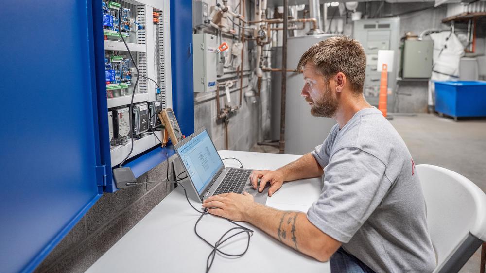 Dylan Hunninghake, McElroy Controls technician, designs an online building controls interface with the Niagara 4 framework.