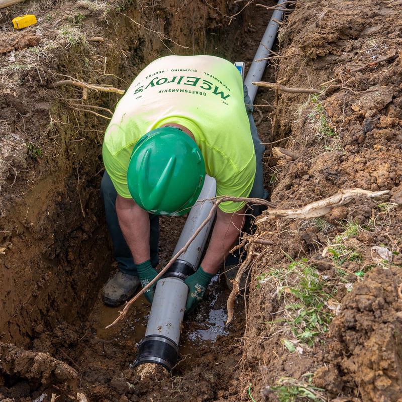 McElroy's residential plumber works on a sewer line replacement.