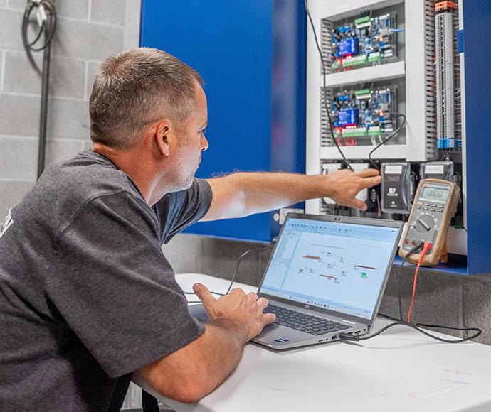 Keith Wattkins checks the installation of building controls.