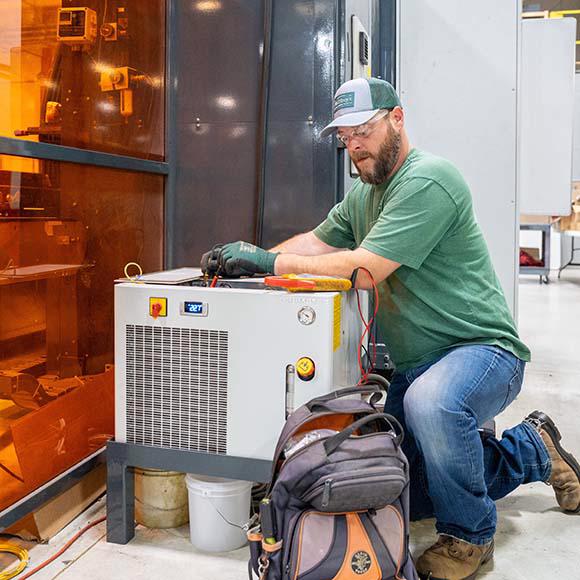 McElroy's technician servicing equipment chiller. 