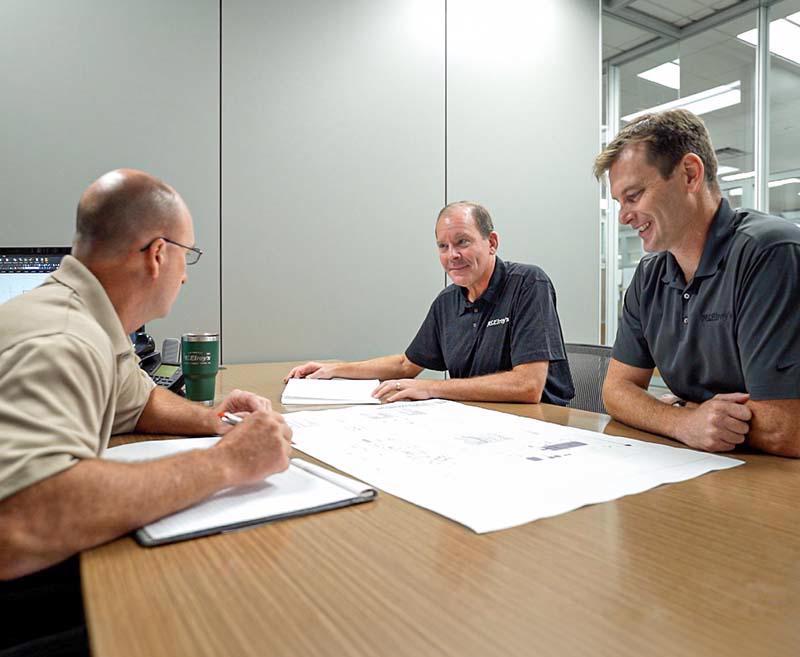 The McElroy's lead engineers discuss a design-build project.