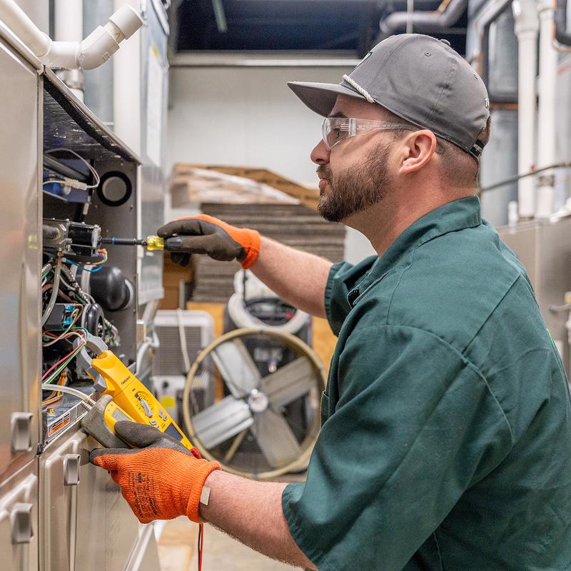 McElroy's technician servicing equipment. 