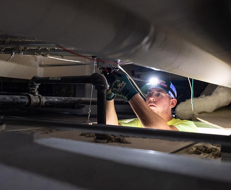 McElroy's technician inspects a fire and smoke damper to ensure safe and reliable operation.