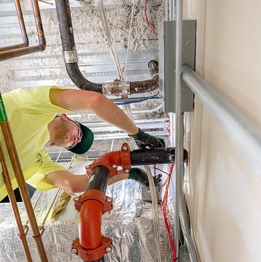 McElroy's technician preforms maintenance work during fire-and-smoke damper inspection, ensuring that dampers work safely and reliably.