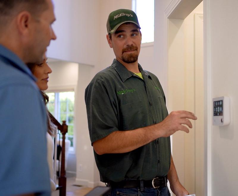 McElroy's residential HVAC technician explains the use of smart thermostat technology to homeowners.