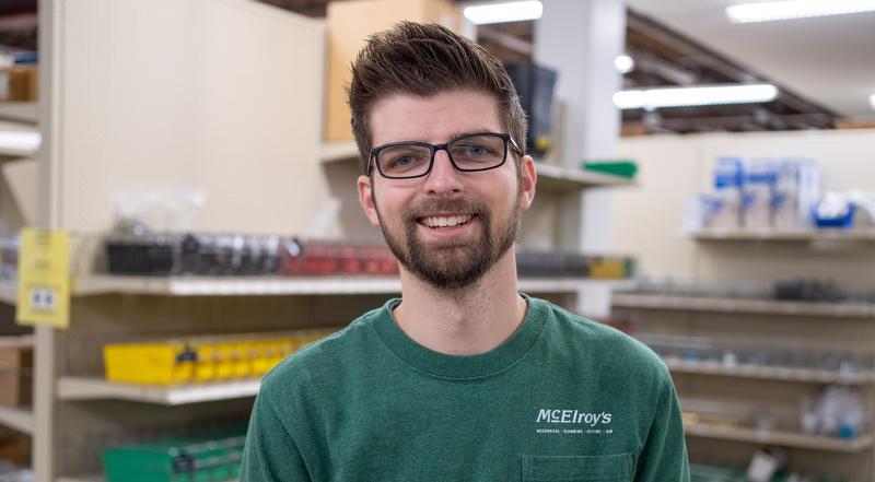 Rawlyn Reynolds, McElroy’s warehouse purchasing associate, celebrates his 10th McElroy’s anniversary, May 24, 2023.
