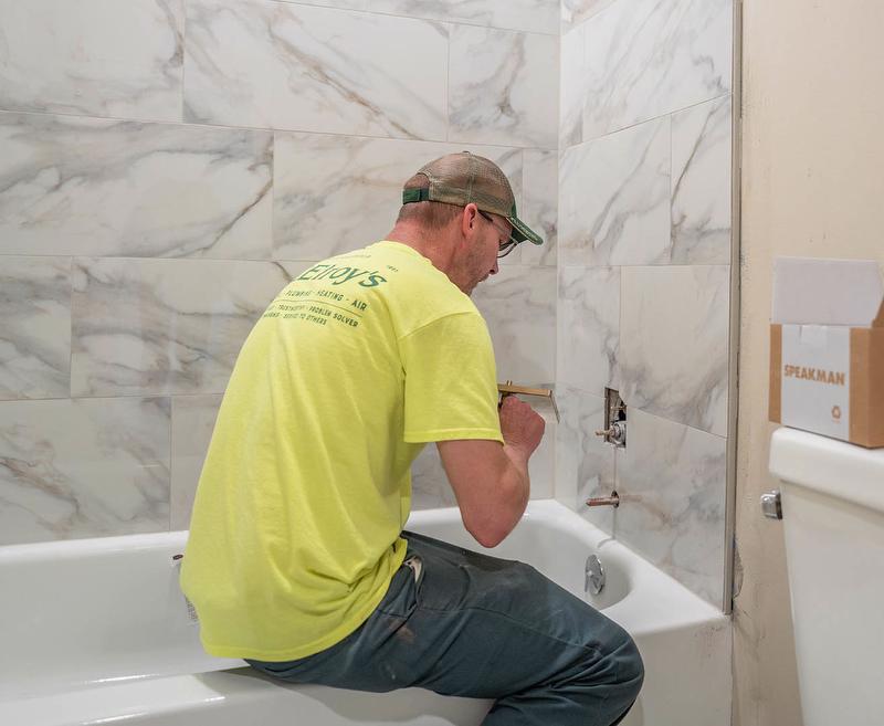McElroy's plumber installs new tub and fixtures.