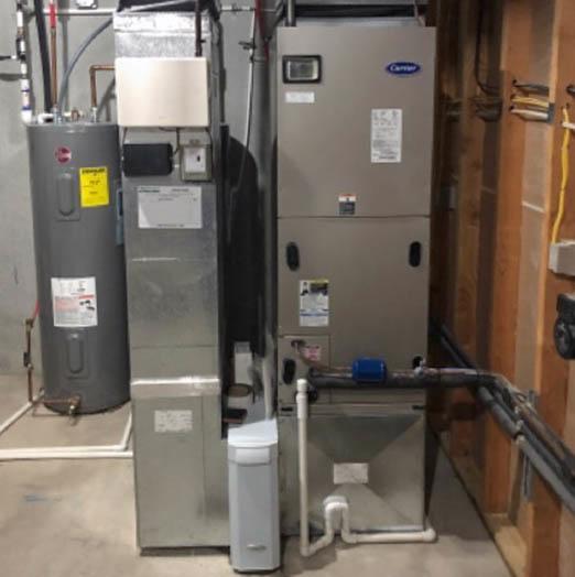The indoor equipment that is part of an energy-efficient geothermal heat pump system, installed by McElroy's.