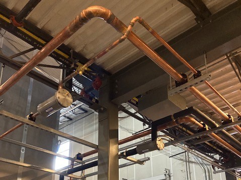 Refrigerant piping by McElroy’s to help add A/C to a large-scale distribution facility in Macon, GA.