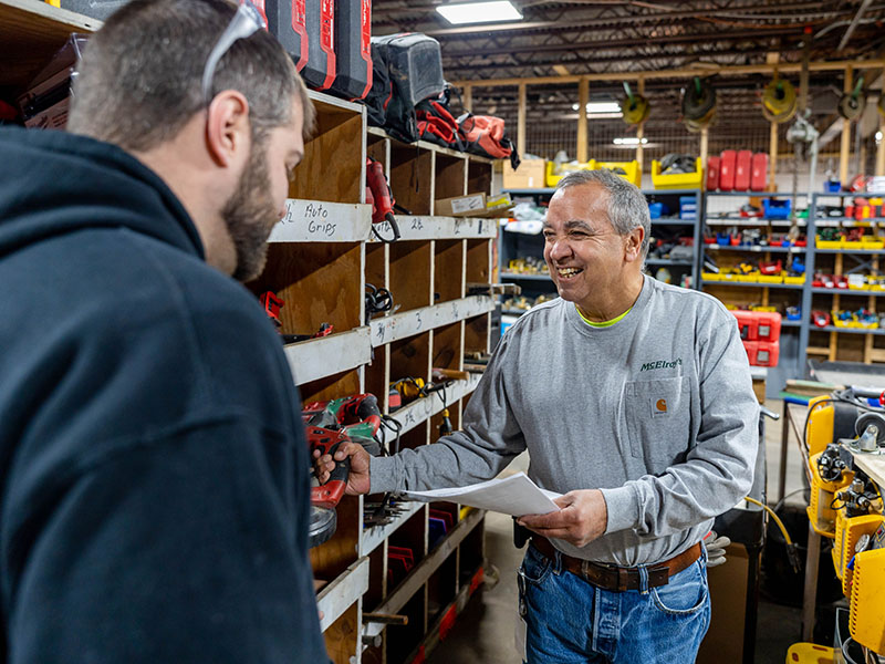 Chuck Smelter, McElroy’s tools manager, shares a joke with Rhett Rawlins as they discuss tool inventories.