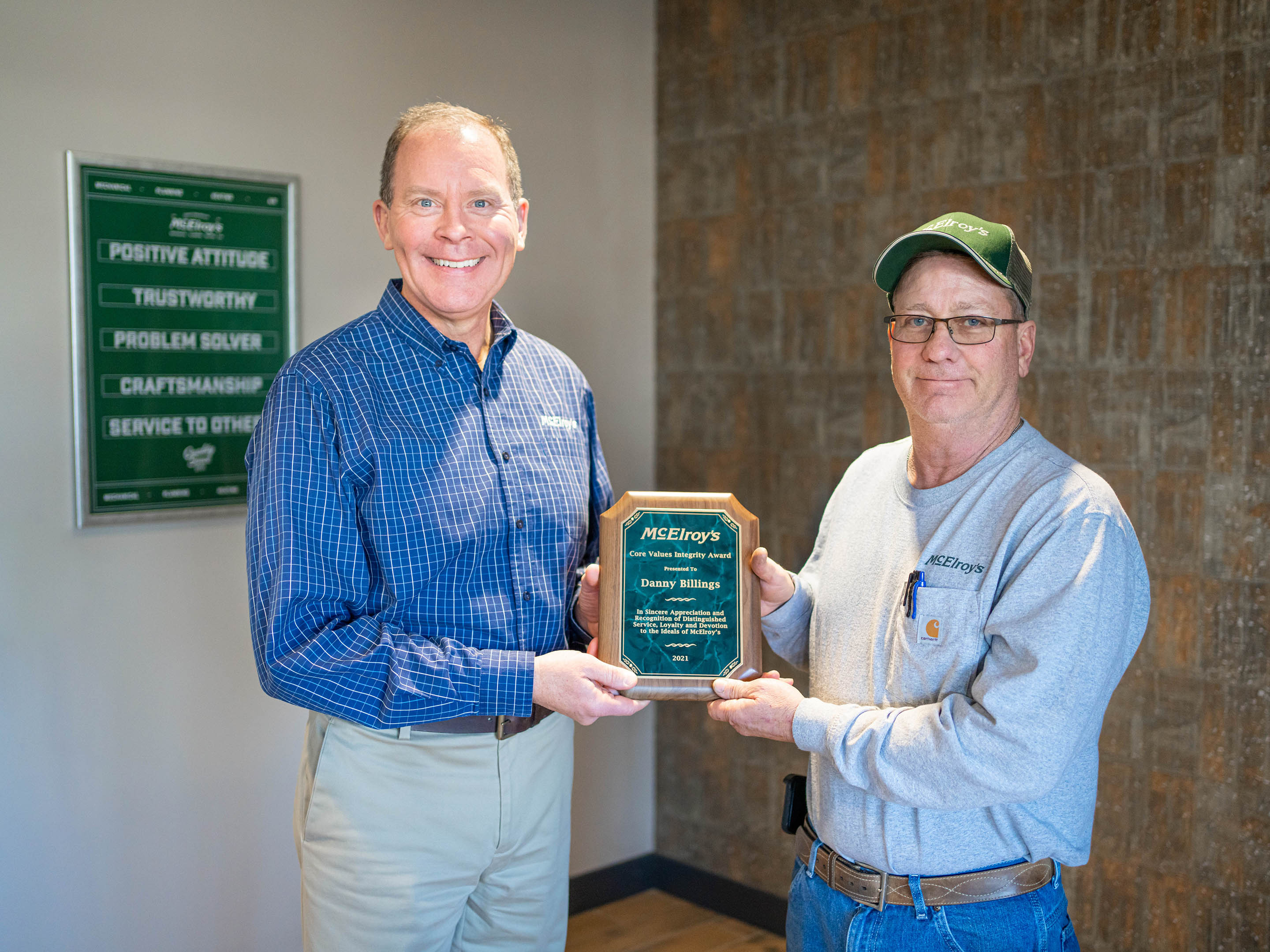 McElroy’s president Dan Beal presents the 2021 McElroy's Core Values Integrity Award to Danny Billings.