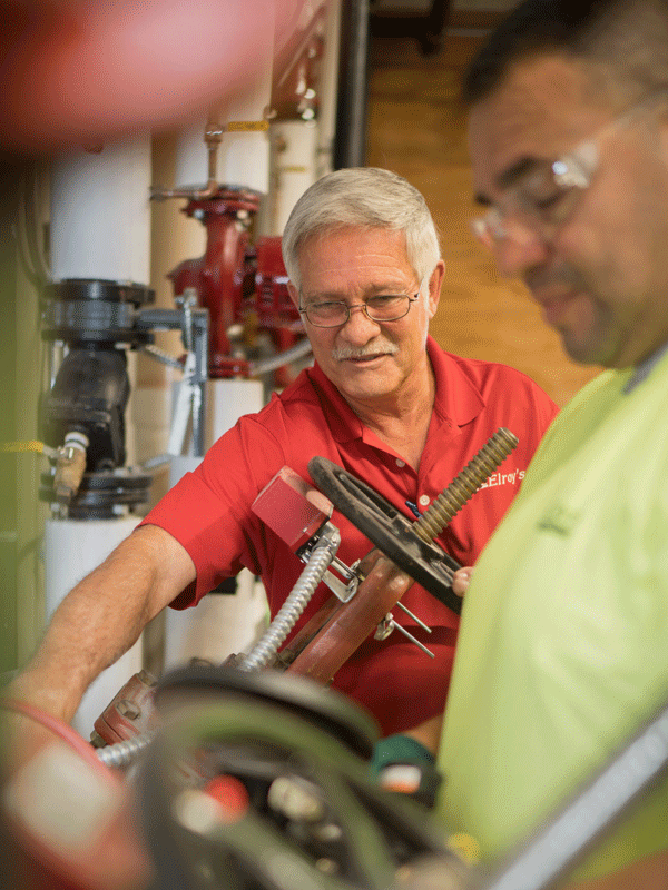 Rendy Habiger and Junior Barajas conduct backflow preventer testing.