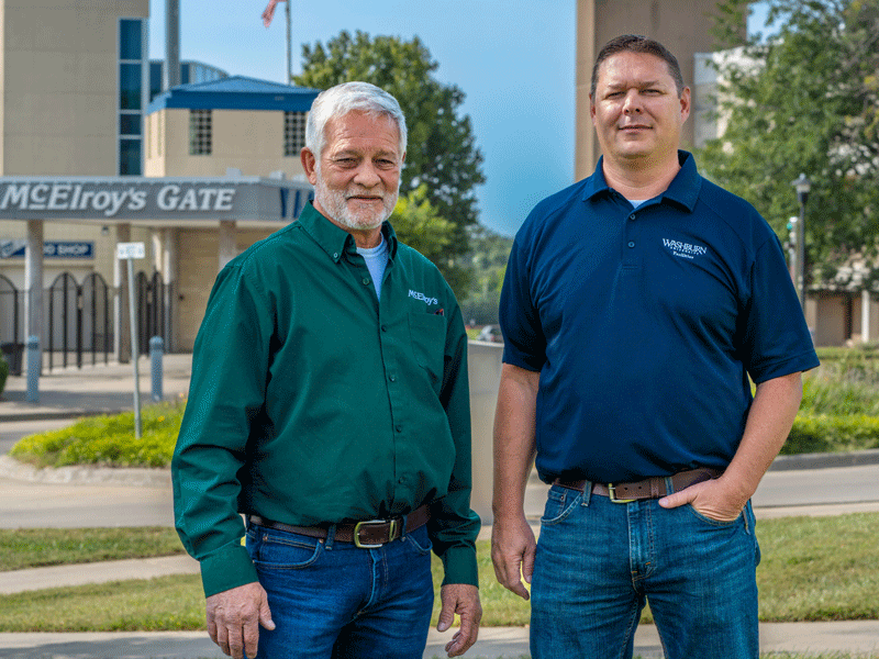 dy Habiger & Matt Harden, assistant director for maintenance at Washburn University, near Yager Stadium’s McElroy’s Gate.