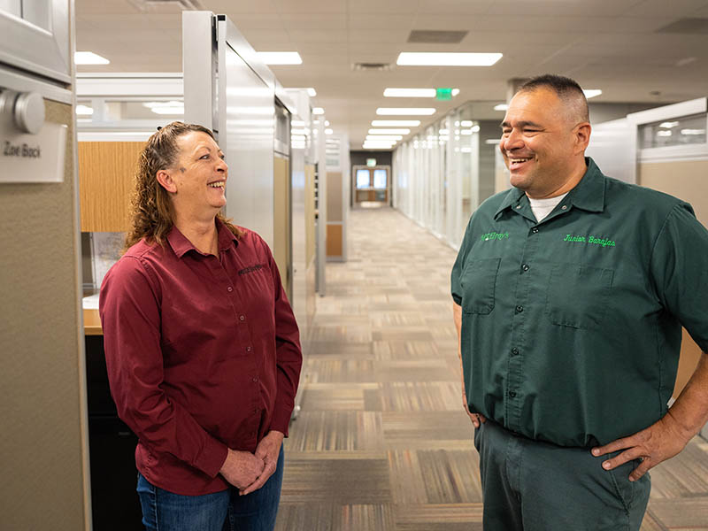 Zoe Bock, McElroy’s plumbing service rep, talks with Junior Barajas, McElroy’s plumbing service technician.