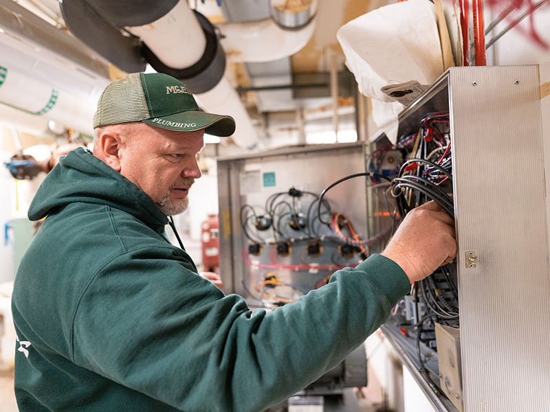 Greg Zabokrtsky, McElroy’s commercial HVAC service technician, performs HVAC systems maintenance at Aldersgate Village.