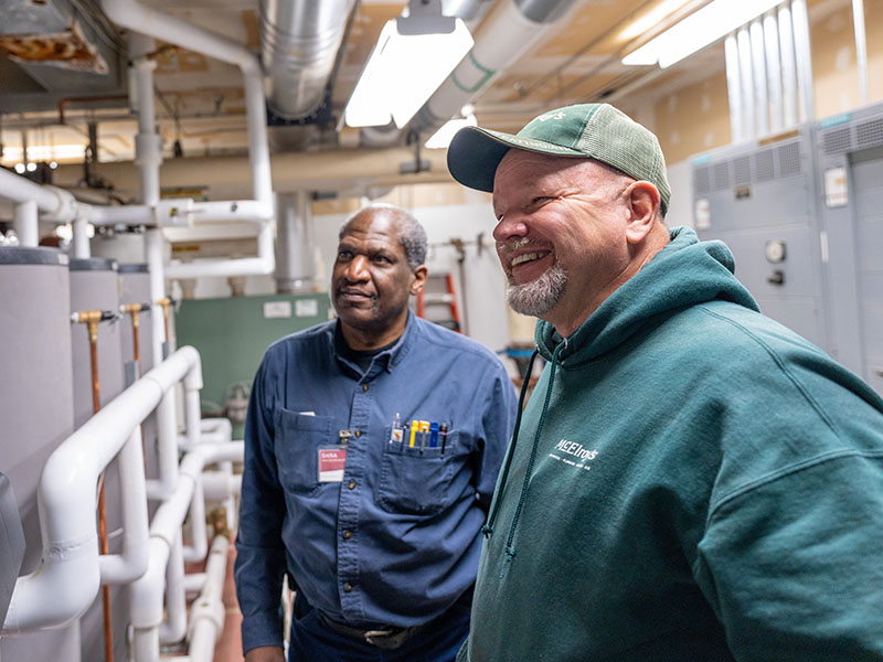 Greg Zabokrtsky of McElroy’s, converses with Dana Anderson, Aldersgate Village associate director of maintenance.