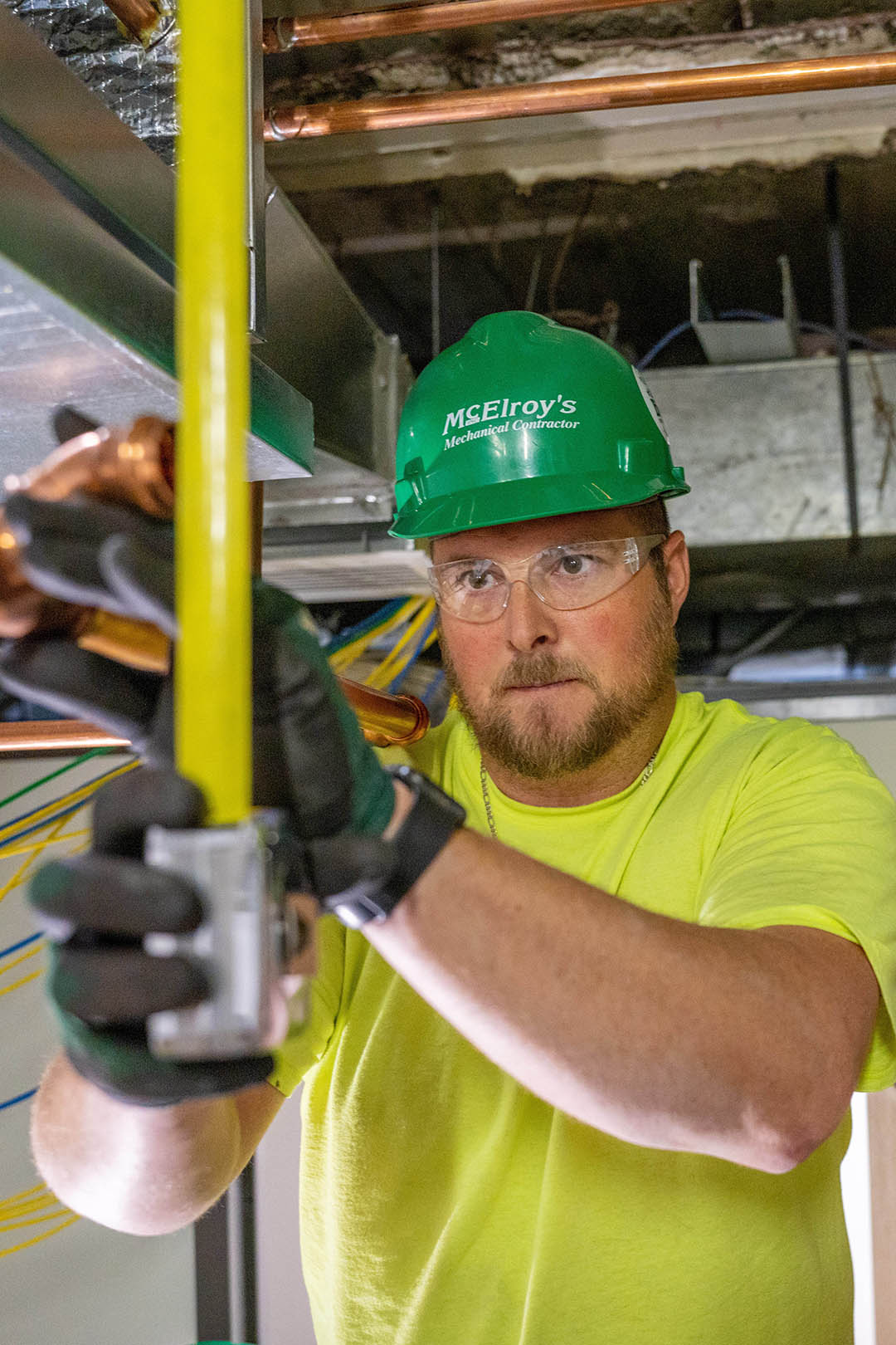 Clint Mayer, McElroy’s commercial construction foreman, takes precise measurements to ensure the high quality of his work.