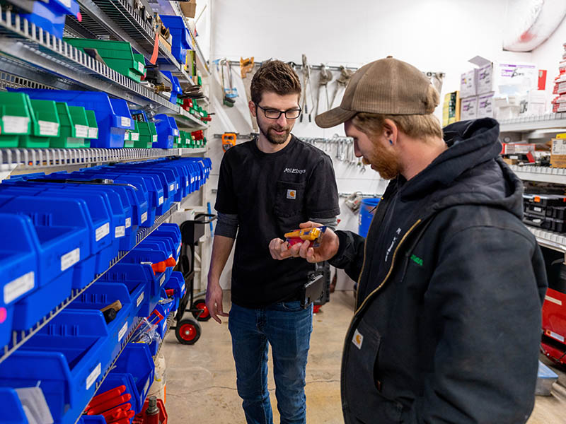 McElroy’s warehouse purchasing associate, Rawlyn Reynolds, provides a field technician with the digital thermometer he needs.
