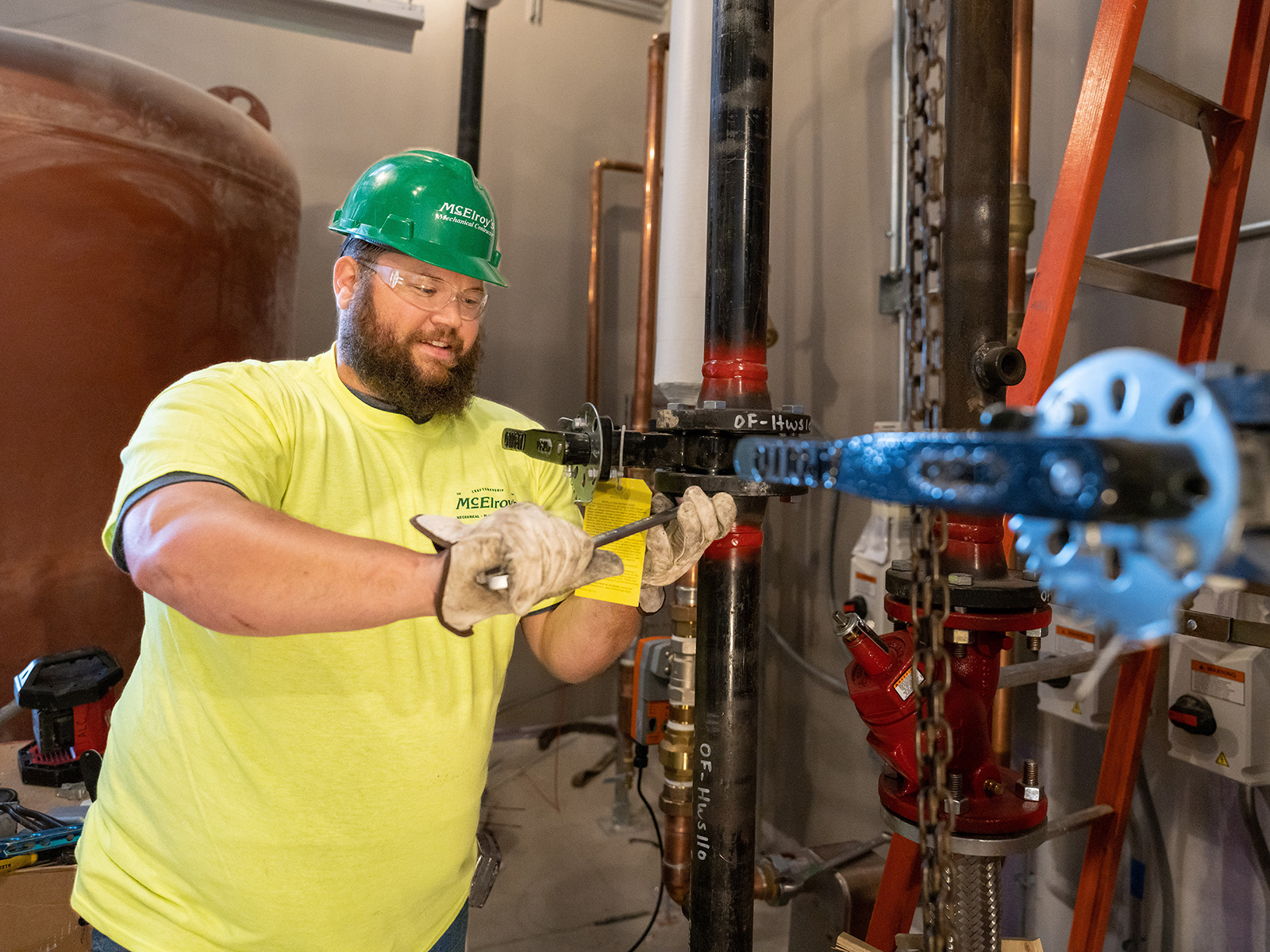 McElroy’s plumbing/pipefitting technician, Chris Perkins, works on new piping at the Evergy Emporia Service Center.