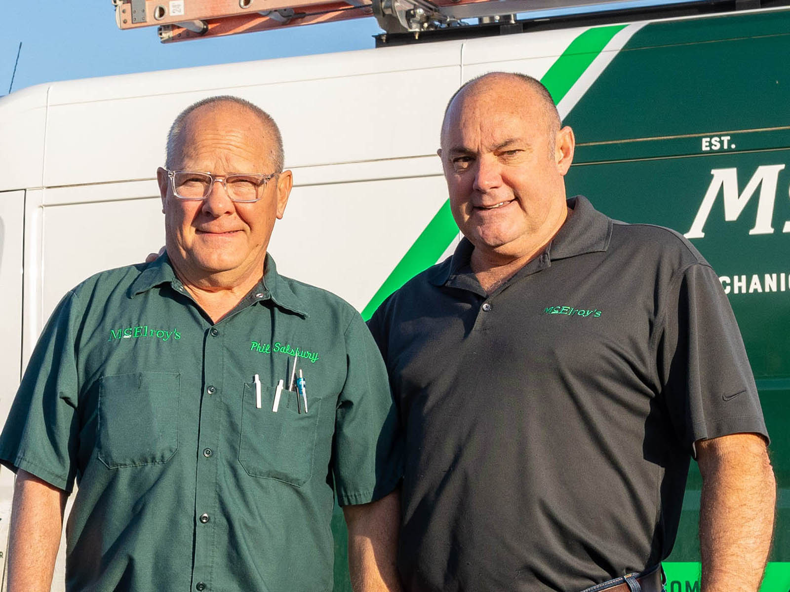 HVAC tech Phil Salsbury and Greg Hunsicker, McElroy’s VP of residential HVAC, have both worked for McElroy’s since 1983.