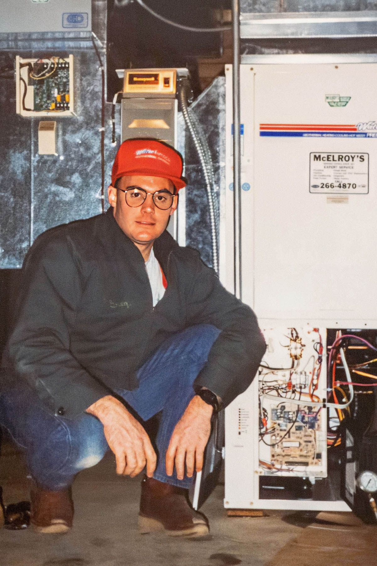 Greg Hunsicker, McElroy’s leader of residential HVAC, with a geothermal furnace installed by McElroy’s in 1990.