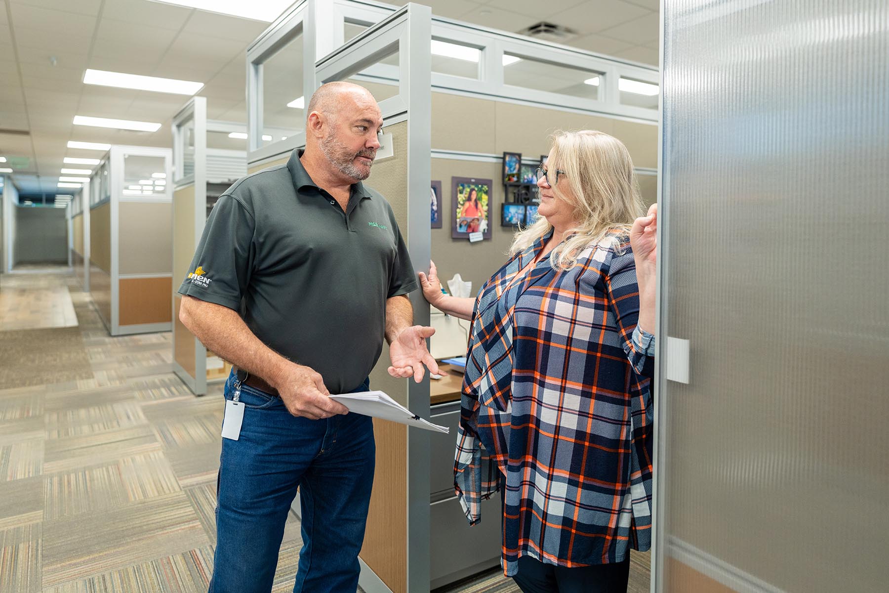 Julie Schirmer, McElroy’s residential HVAC service rep, and Greg Hunsicker, leader of the McElroy’s residential HVAC team, discuss a customer service call.