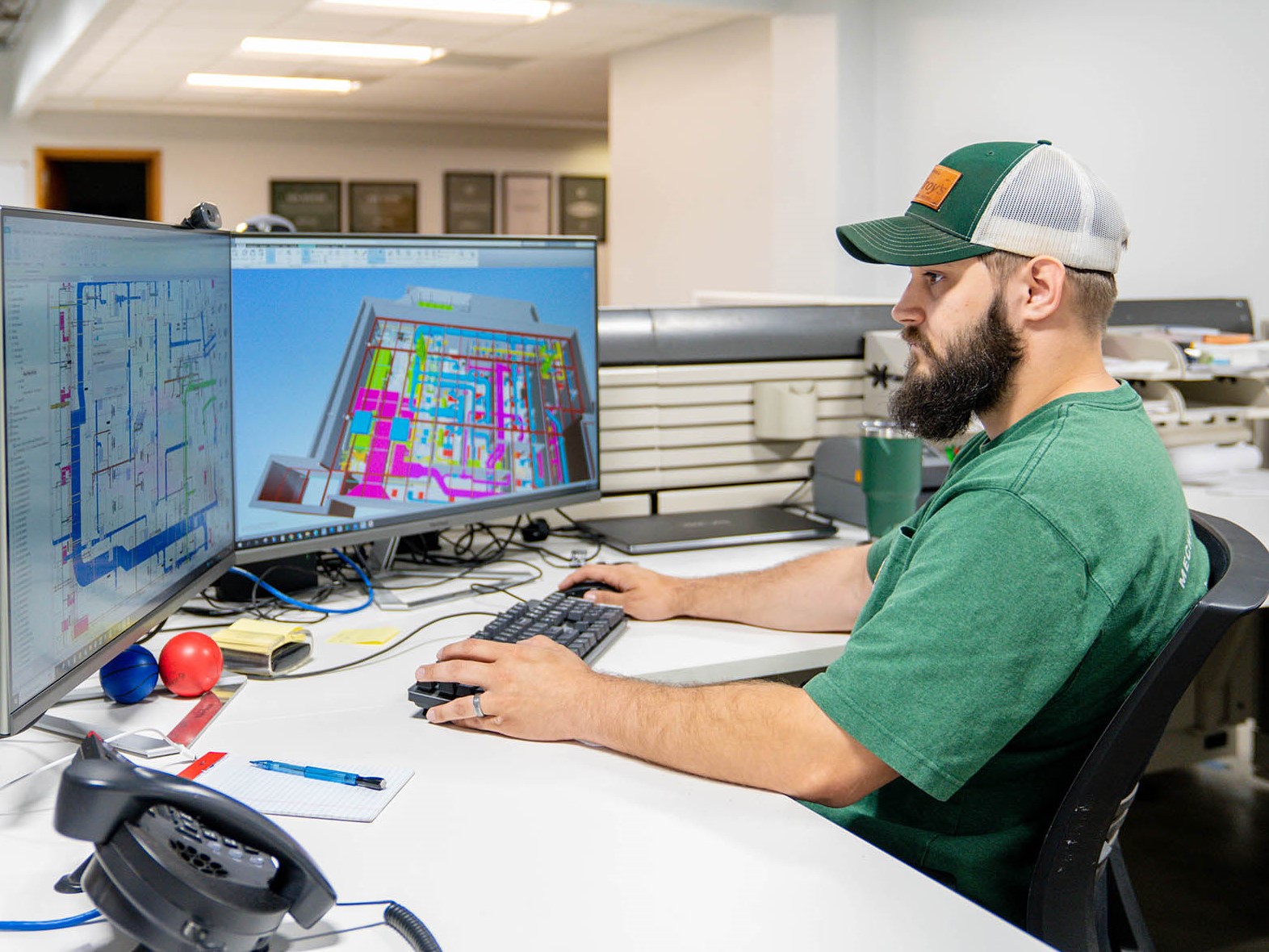 Joey Towle, McElroy’s BIM designer, uses Building Information Modeling software to ensure that mechanical systems work together as expected.