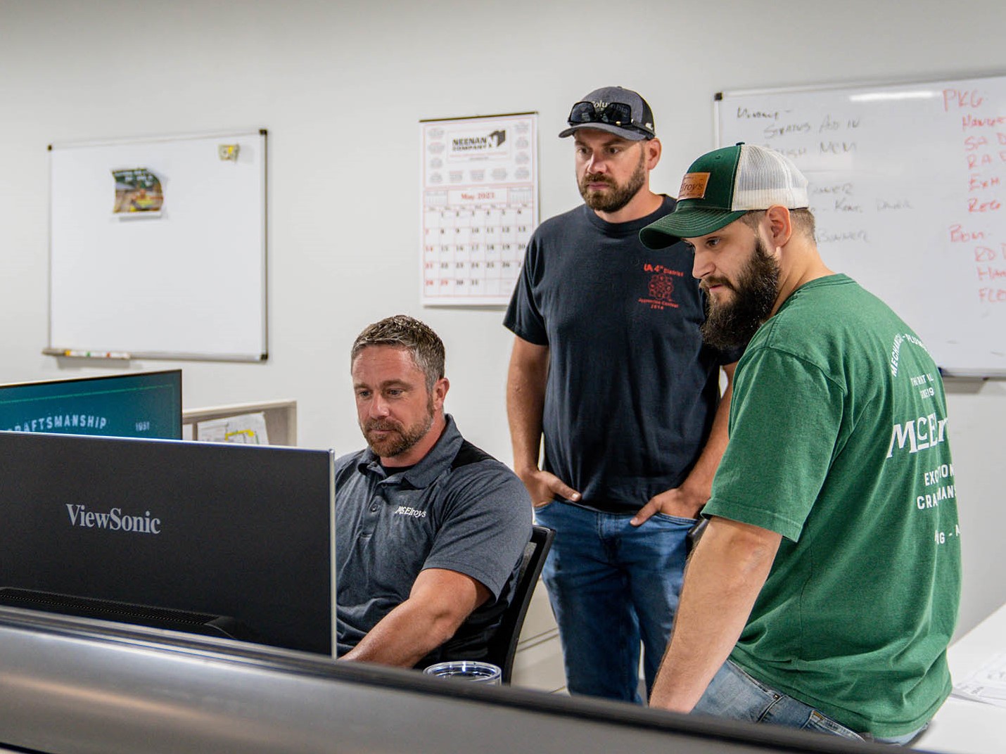 John Hoyt, McElroy’s director of VDC, Brent Eisenbarth, McElroy’s BIM designer, and Joey Towle review a BIM design.