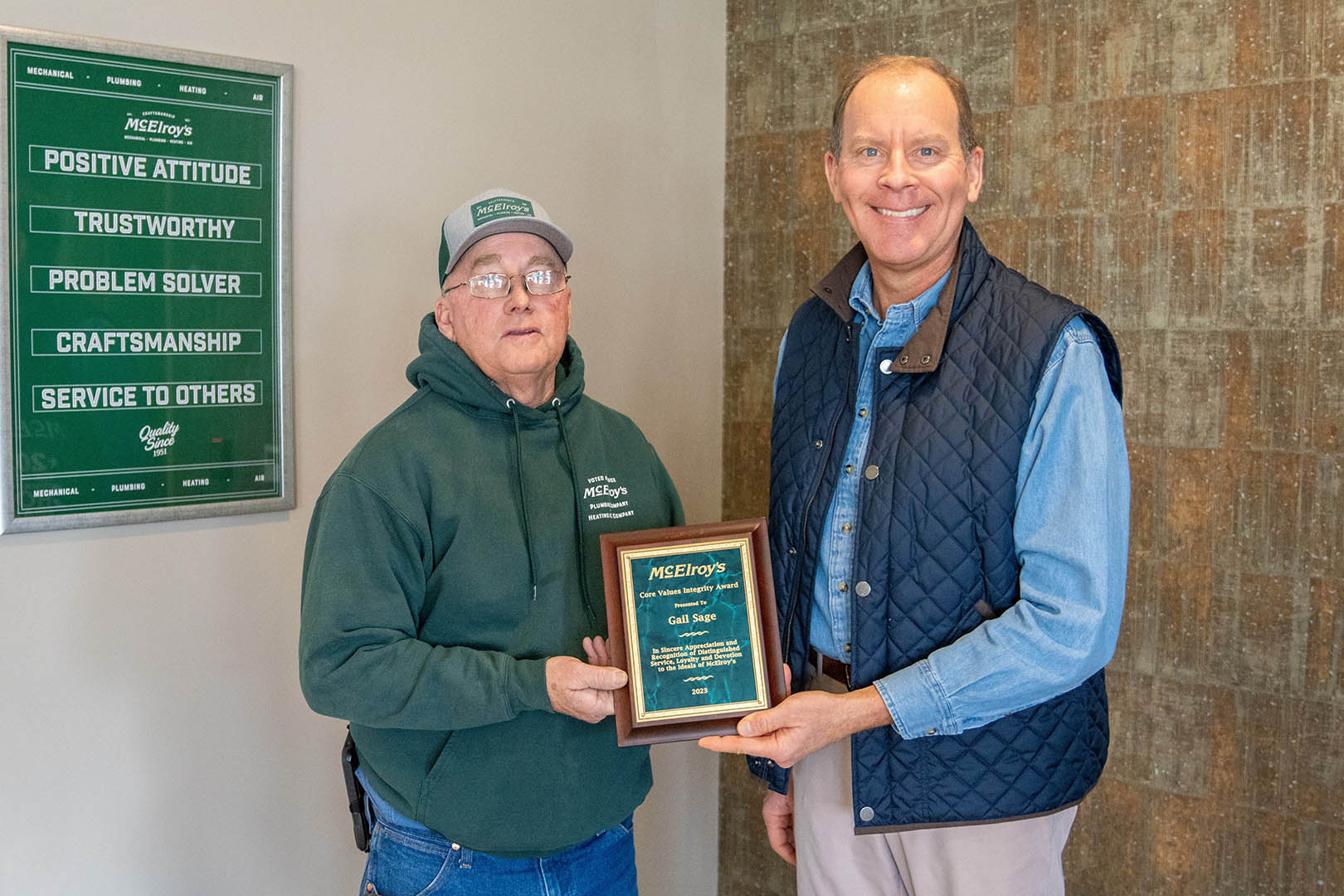 McElroy’s president Dan Beal presents the 2023 McElroy's Core Values Integrity Award to Gail Sage.