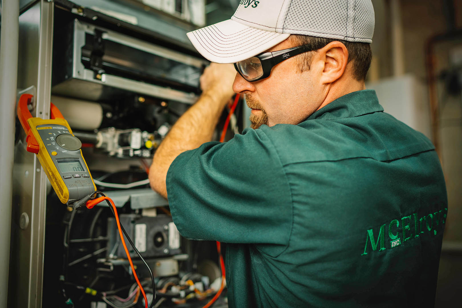 Kirk York works on servicing a residential furnace in 2018.