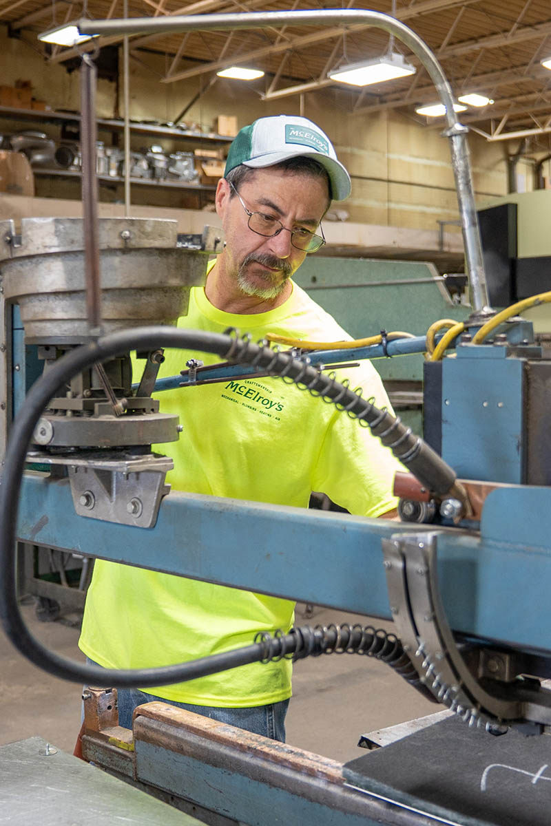 David Dechand, McElroy’s sheet-metal shop steward,  pins insulation to a piece of ductwork.