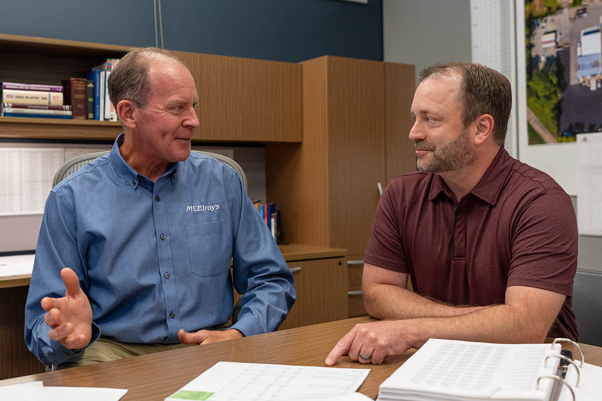Nathan Stillings, McElroy’s chief financial officer, discusses financial matters with Dan Beal, McElroy’s chairman.