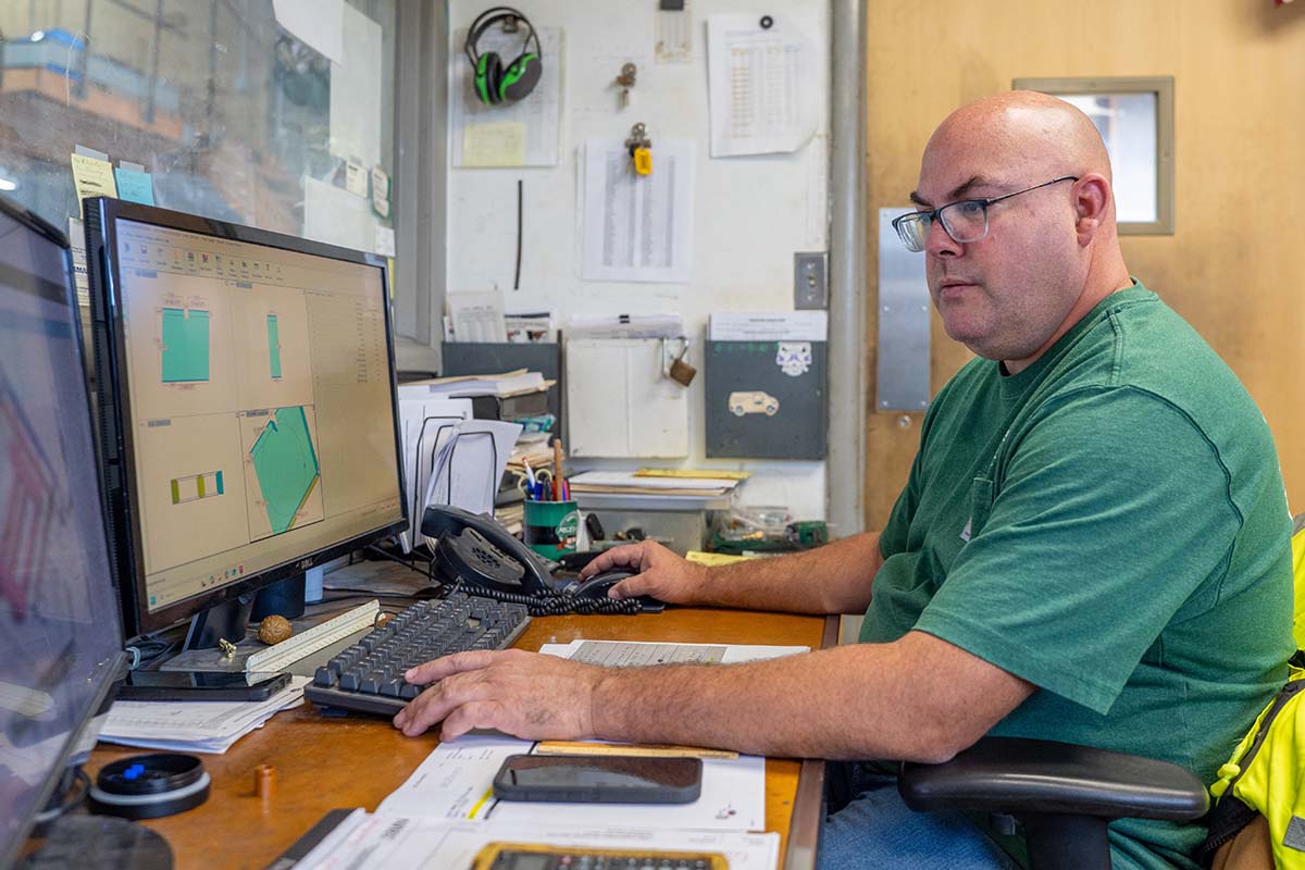 Anthony Decker, McElroy’s sheet-metal shop foreman, reviews designs on his computer.