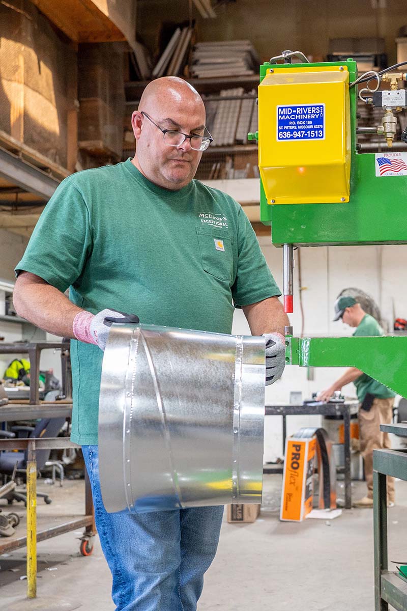 Anthony Decker, shop foreman, fabricates a section of air duct in the McElroy’s sheet-metal shop.