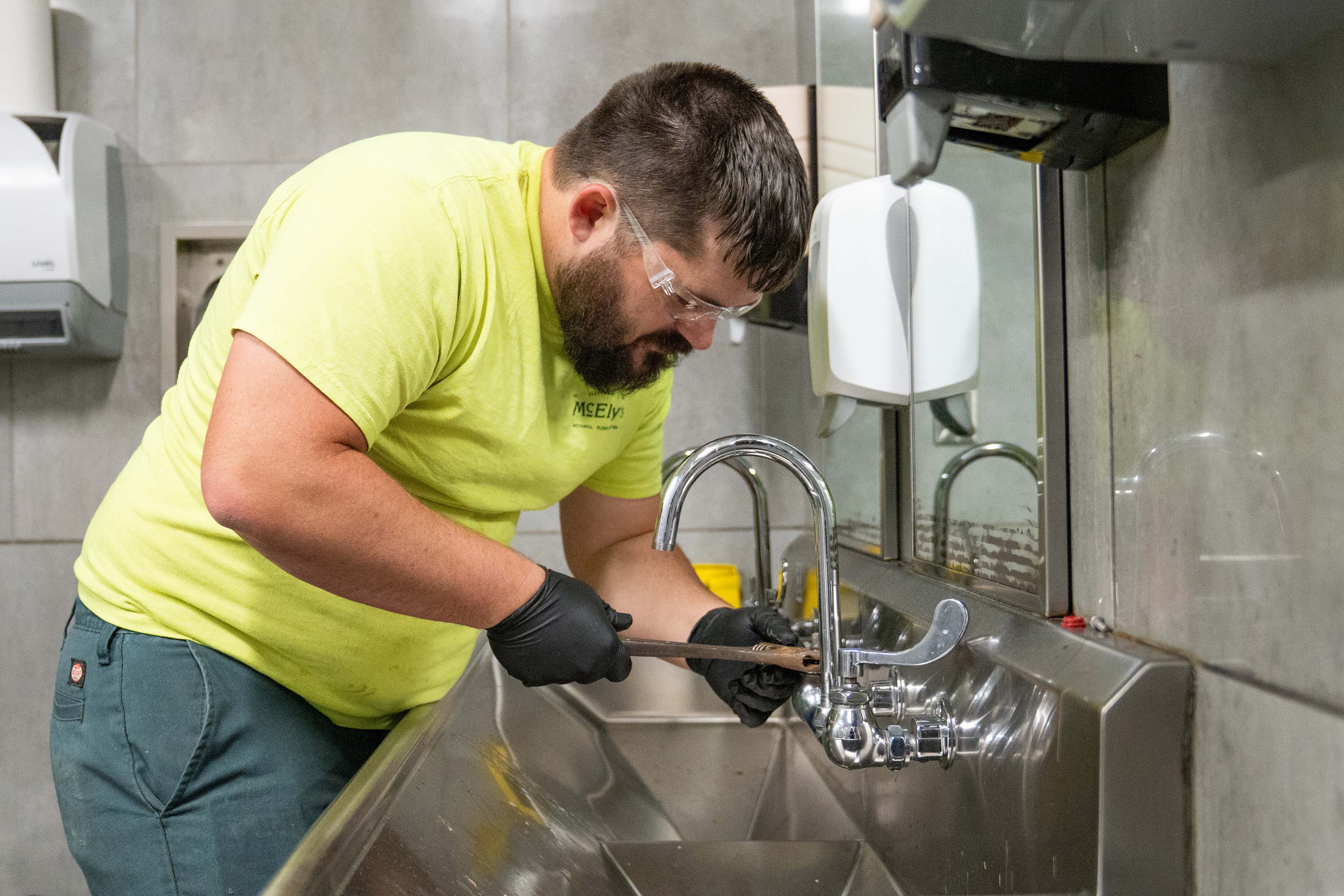 Keith Gerisch, McElroy’s plumber, puts his skills to work on installations, repairs and maintenance.