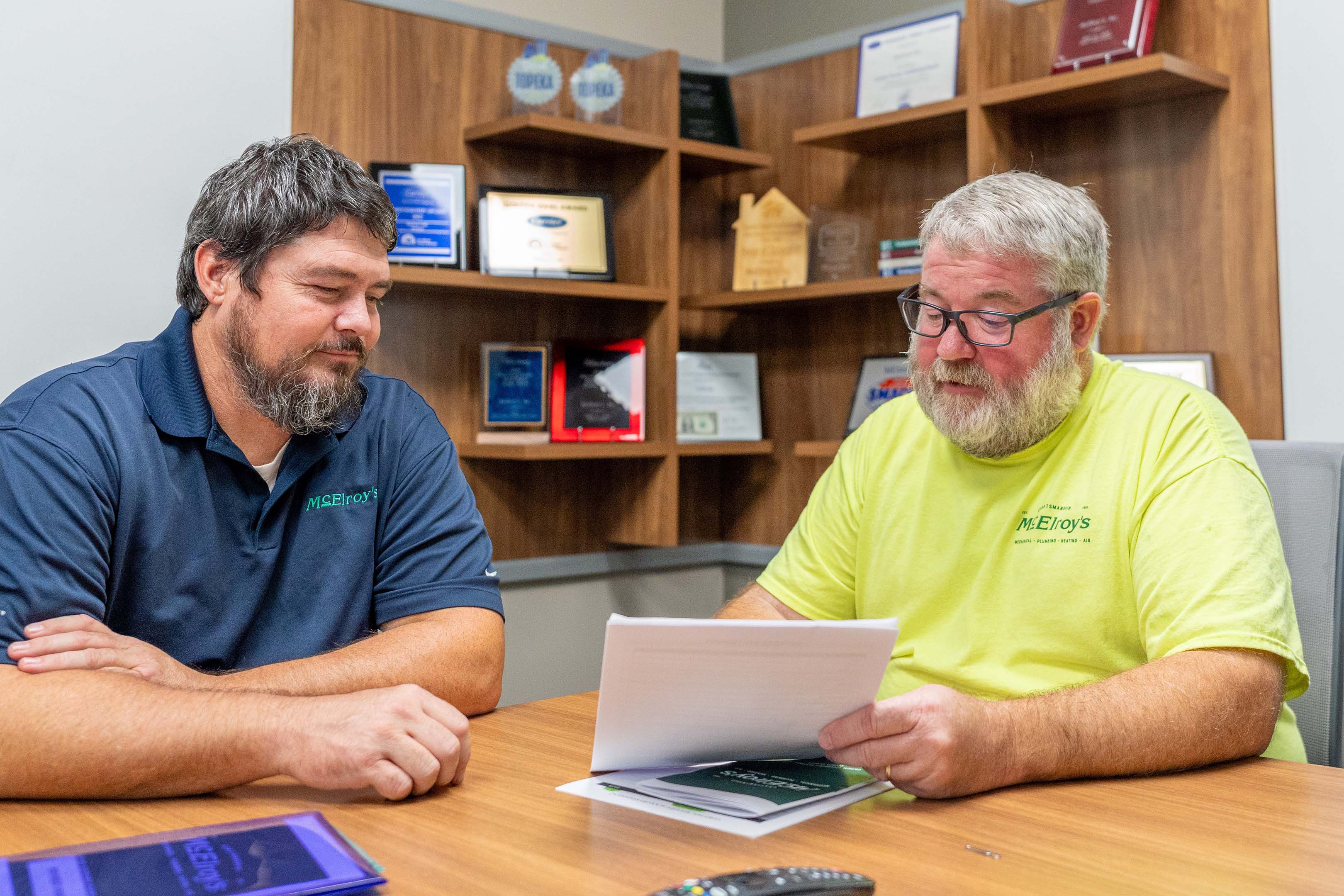 Shawn O’Malley, McElroy’s safety manager, discusses safety matters with Luke Dumler, McElroy’s plumbing service manager.