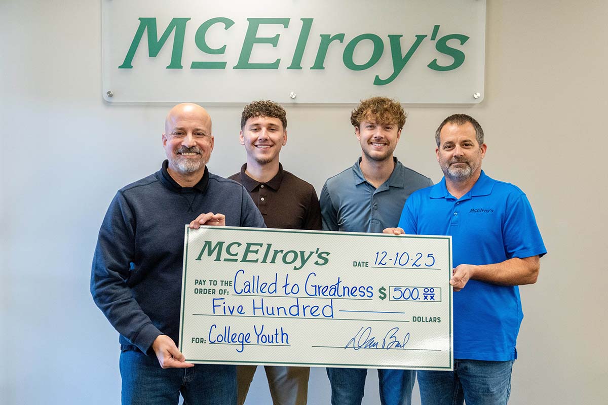 Keith Watkins presents his $500 honorary donation to the Called to Greatness college campus ministry.