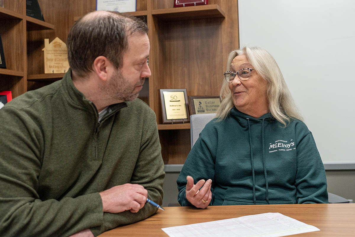 Joanne Ortiz, of the McElroy’s accounting team, works with Nathan Stillings, McElroy's CFO.