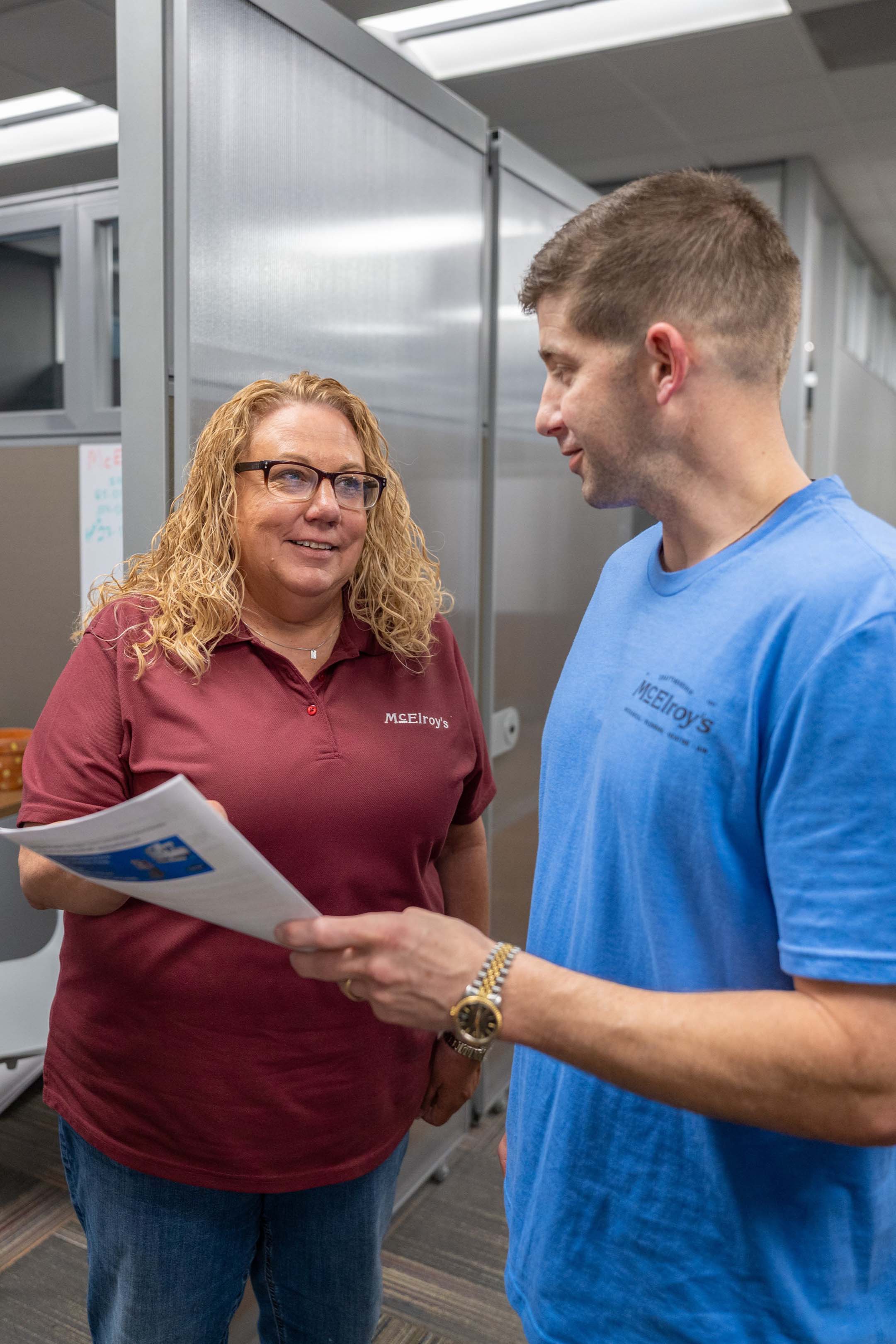 McElroy’s assistant project manager, Alyssa Gentry, discusses a job with Jimmy Thomas, commercial project manager.